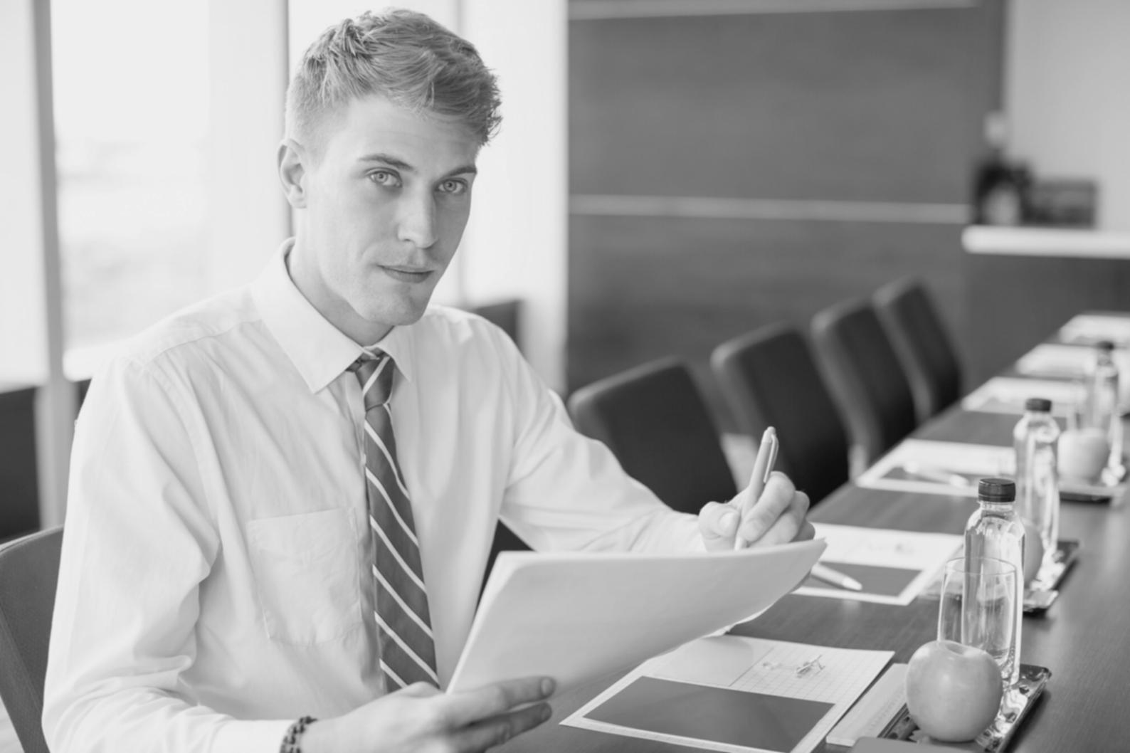 Modern investment education classroom environment with financial charts and learning materials